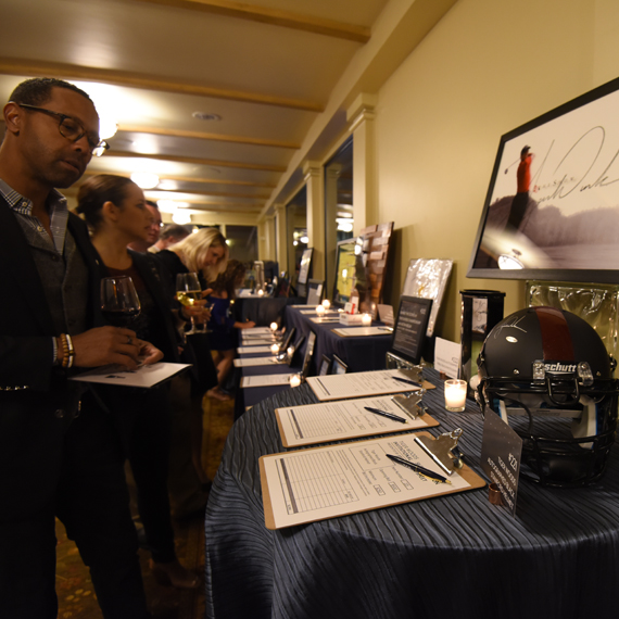 Guests bid on silent auction items